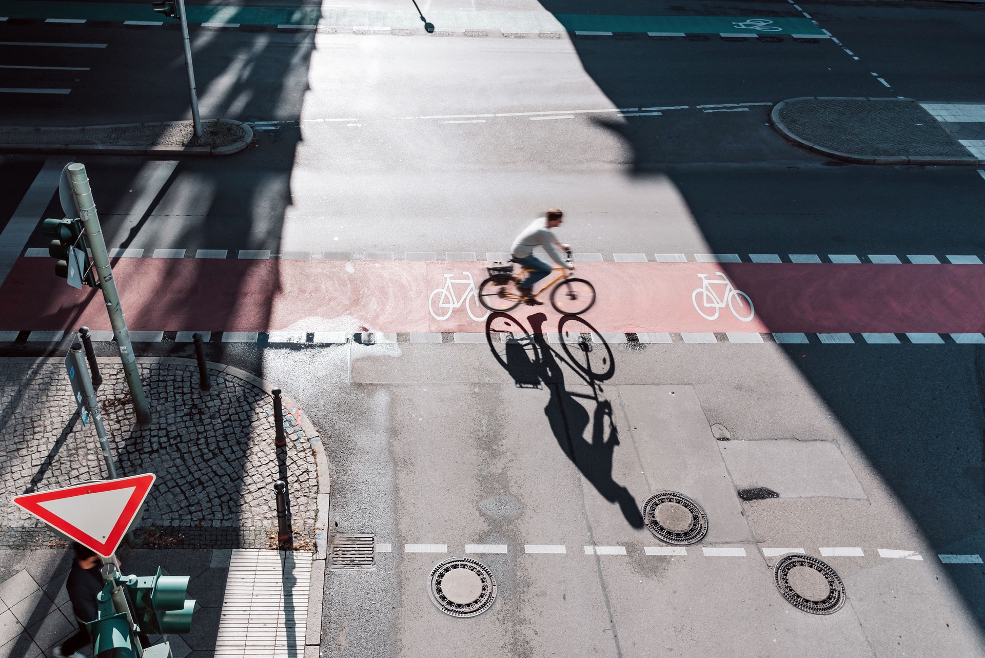 men on bicycle on crossroad in berlin